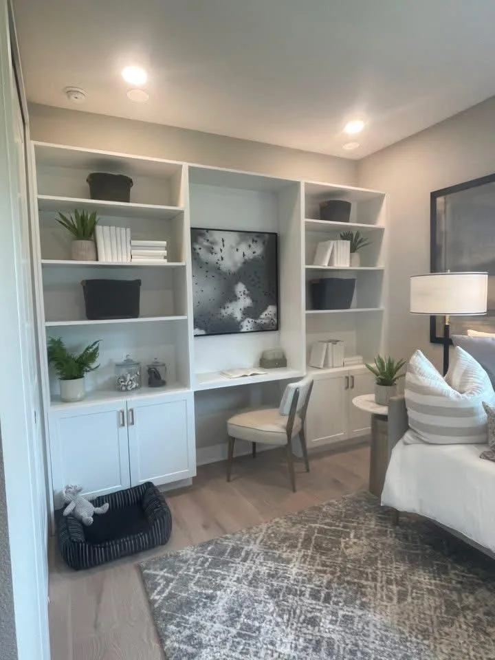 Custom home-office built-in with white bookshelves, a desk, and integrated cabinetry